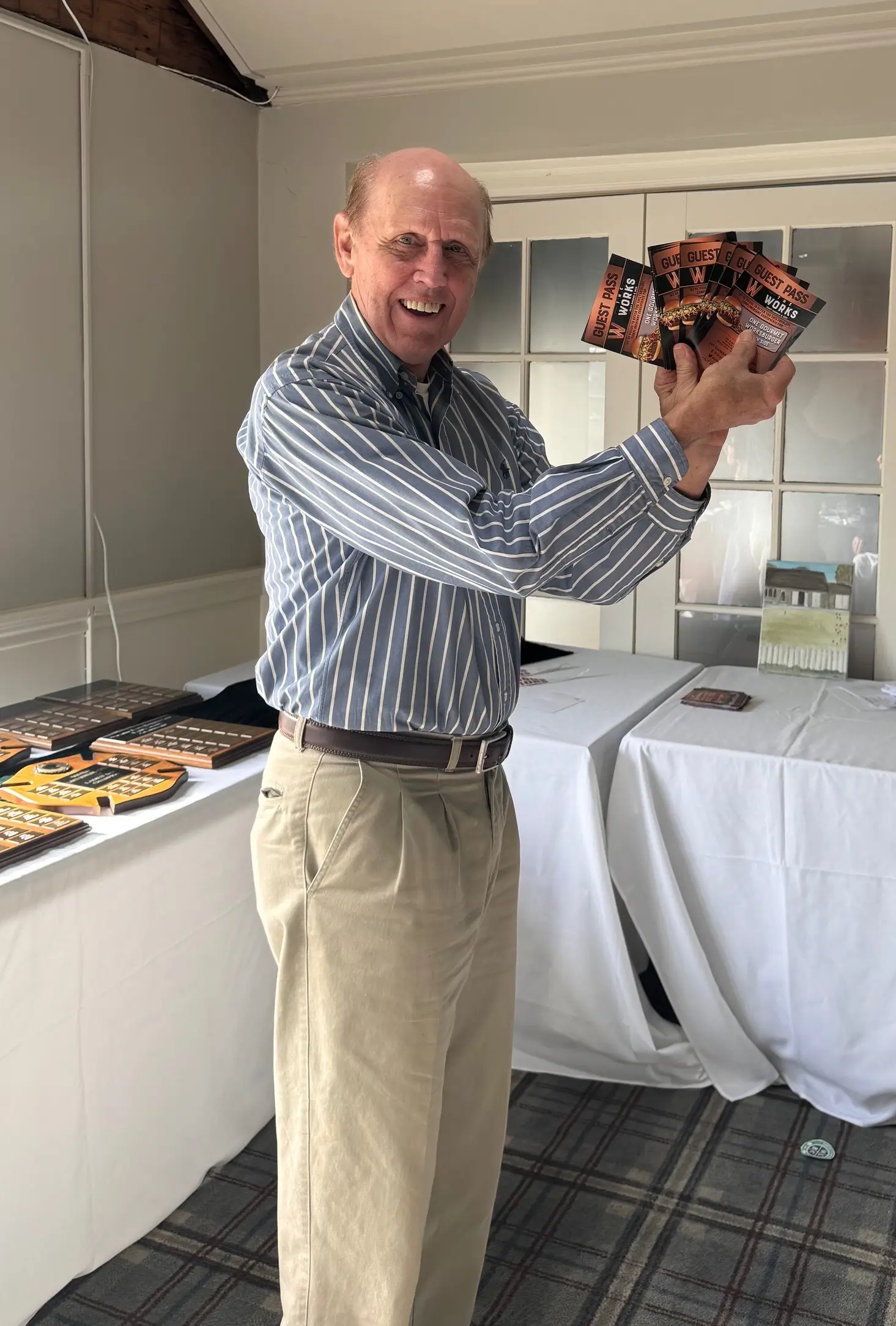 A man holding up some food in front of him.